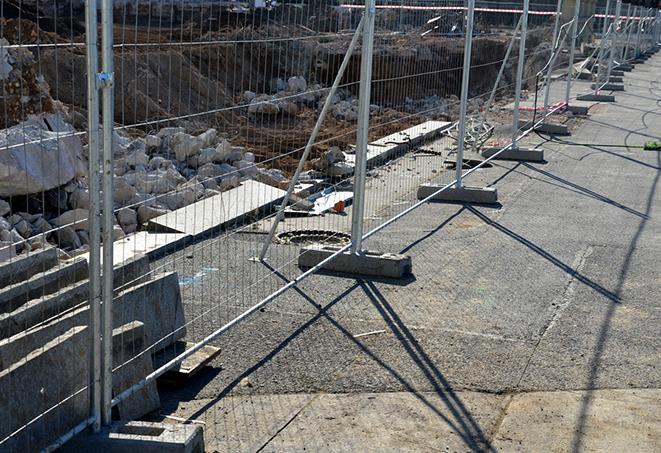 temporary fence panels in place to secure a public space for maintenance